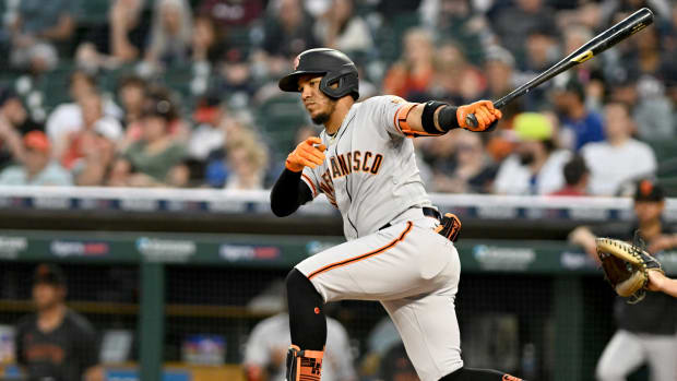 SF Giants left fielder Thairo Estrada hits a double down the third base line against the Detroit Tigers. (2023)